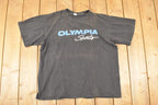 Vintage 1990s Olympia Sports Souvenir Travel T-Shirt Men's XL