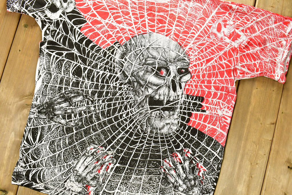 Vintage 1990s All Over Print Skull Pile And Spider Web T-Shirt