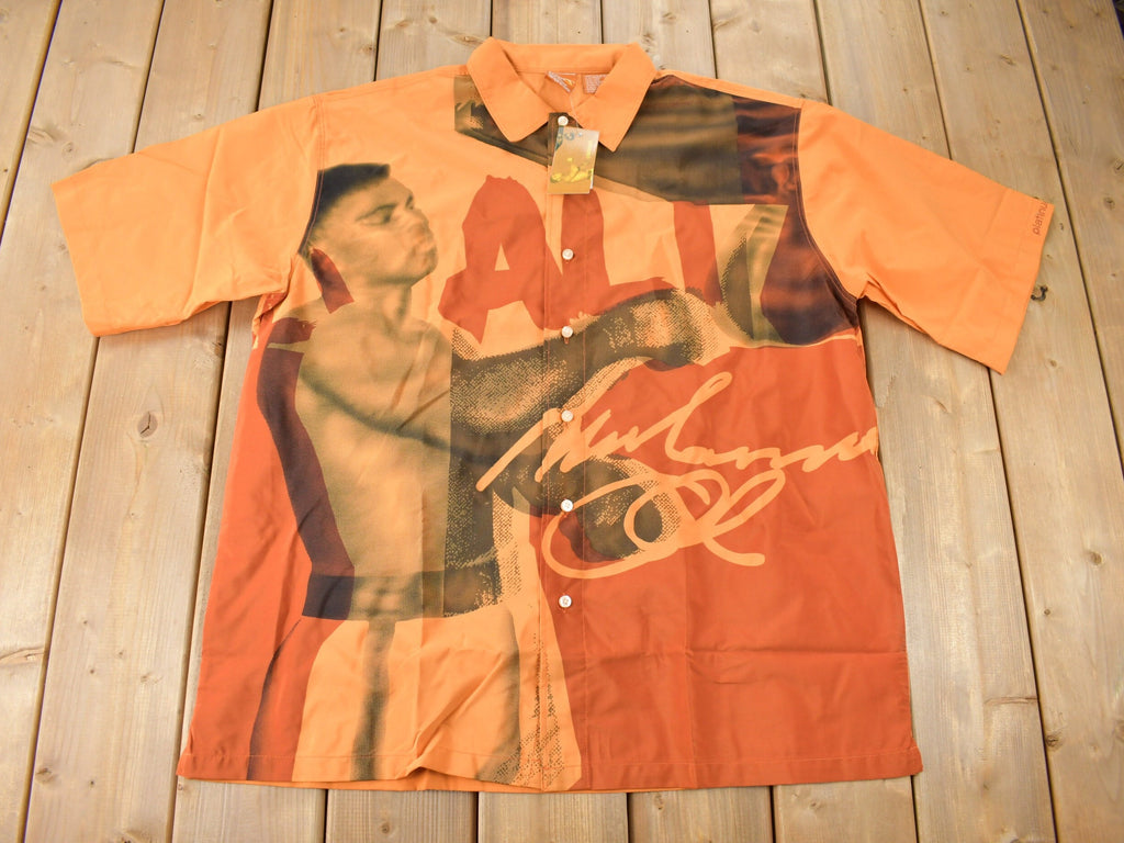 Vintage 1990s Deadstock Platinum Fubu Muhammad Ali All Over Print Button Up Shirt