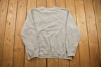 Vintage 1990s Grey Nike Embroidered Mini Swoosh Crewneck Sweatshirt
