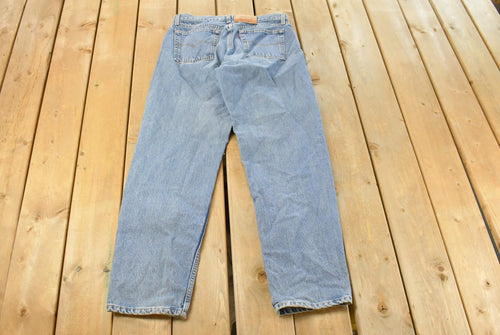 Vintage 1990s Levi's 560 Loose Straight Denim Jeans Women's 32 x 31 / 90s Levi's / Distressed Sun Faded Jeans