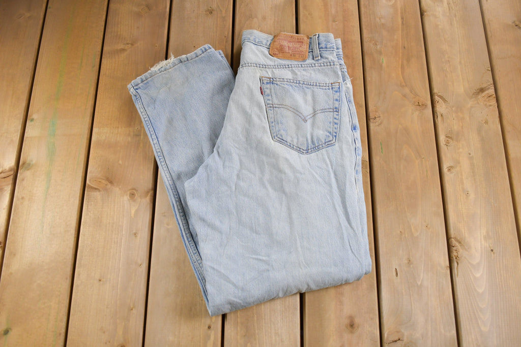 Vintage 1990s Levi's 550 Red Tab Ripped Denim Jeans Size 32 x 31