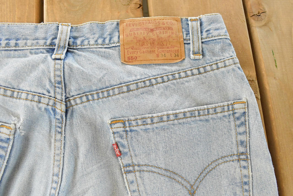 Vintage 1990s Levi's Distressed 550 Relaxed Fit Denim Jeans Men's 33 x 33 / 90s Levi's / Blown Out Sun Faded Jeans