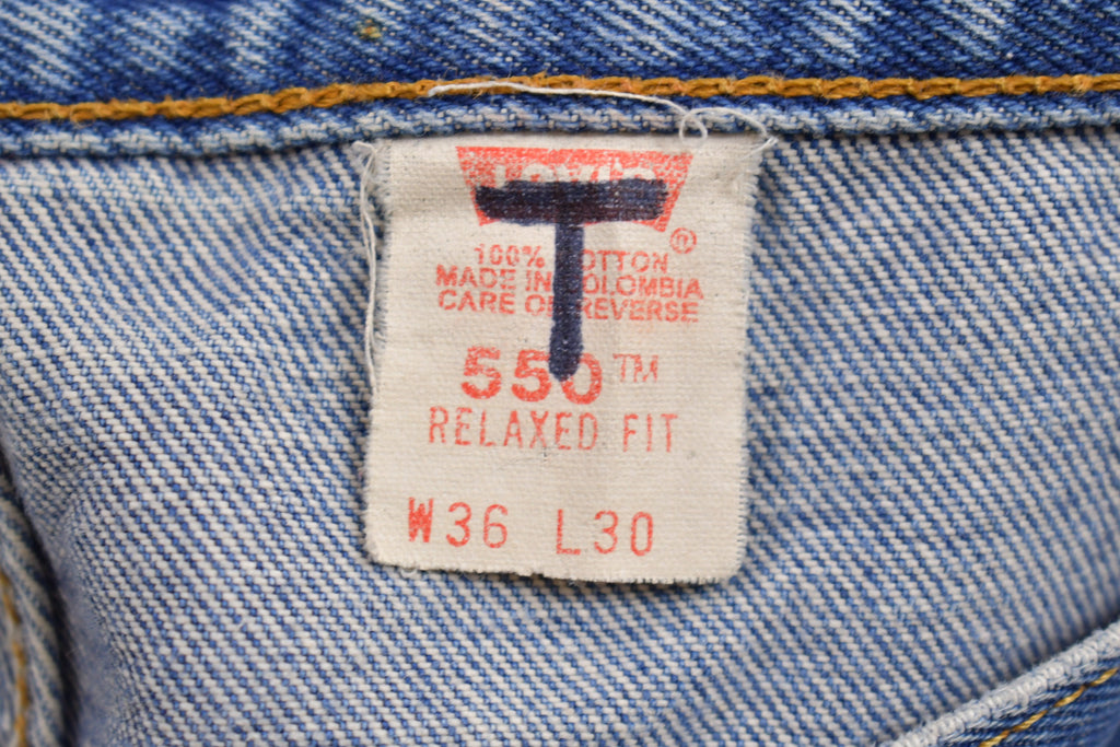 Vintage 1990s Levi's 550 Red Tab Jeans Size 36 x 29.5 / Blue / Denim / Made In USA / 90s Levi's / Tapered Fit / Distressed