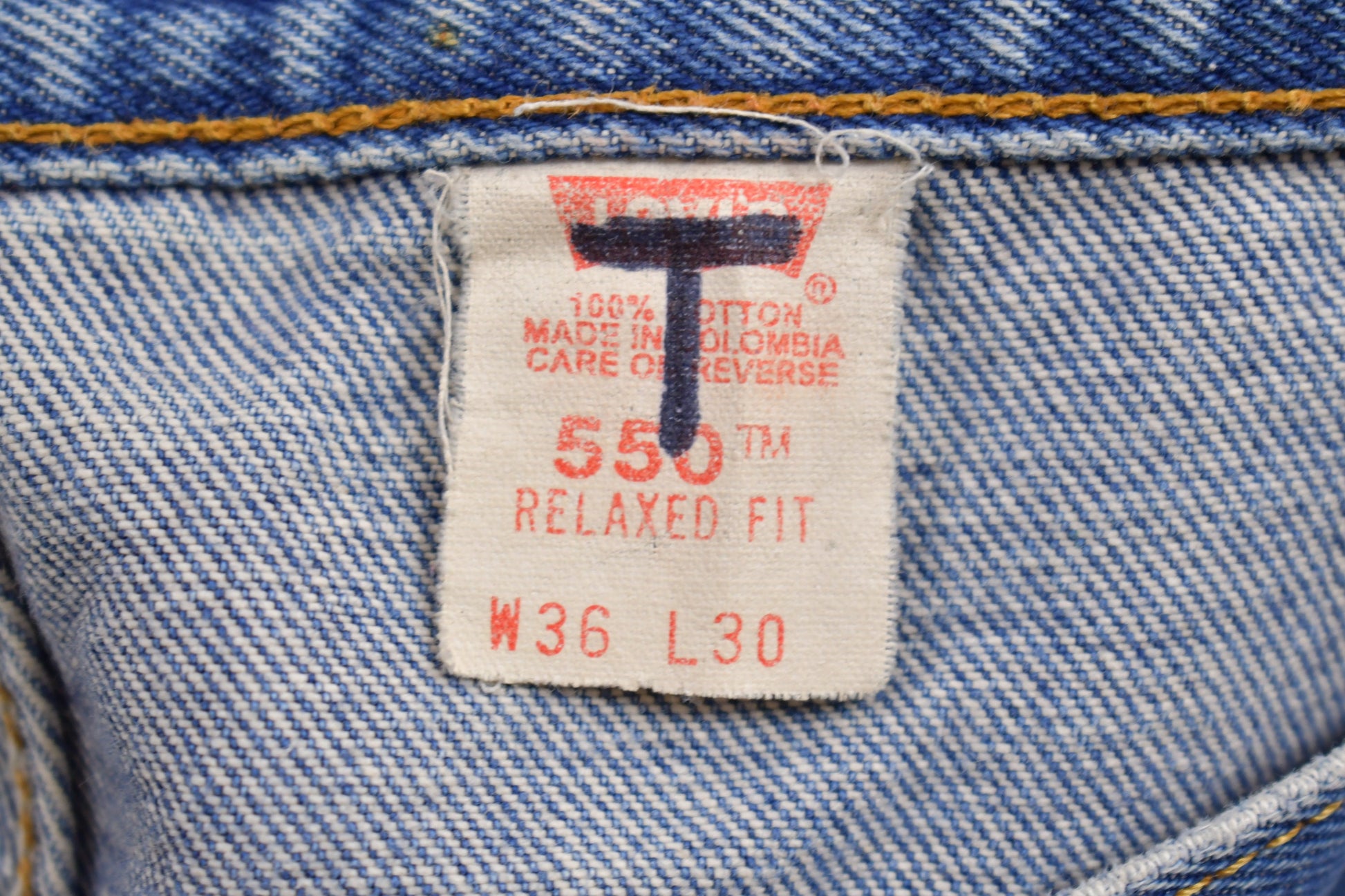 Vintage 1990s Levi's 550 Red Tab Jeans Size 36 x 29.5 / Blue / Denim / Made In USA / 90s Levi's / Tapered Fit / Distressed