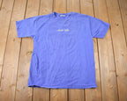 Vintage 1990s Climb High Tail Wag Idaho Dog Theme Graphic T-Shirt Made In USA