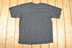 Vintage 1990s Rackarchy AOp Skulls Souvenir T-Shirt Men's L