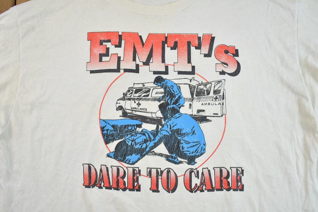 Vintage 1980s EMT Dare To Care Souvenir T-Shirt