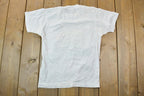 Vintage 1989 Heartland Apparel Minnesota Farm Team Graphic T-Shirt