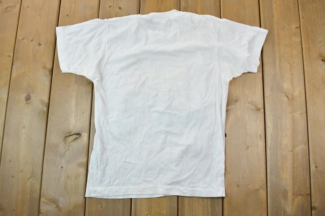 Vintage 1989 Heartland Apparel Minnesota Farm Team Graphic T-Shirt