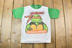 Vintage 1990 Teenage Mutant Ninja Turtles Cowabunga Michaelangelo Graphic Child Size T-Shirt