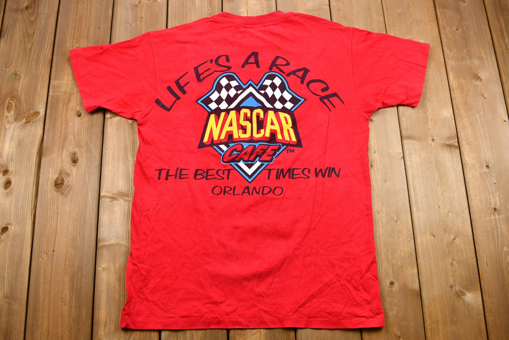 Vintage 1990s NASCAR Café Orlando Graphic T-Shirt / Single Stitch / Racing / 90s Streetwear / Life's A Race The Best Times Win / Sportswear