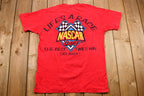 Vintage 1990s NASCAR Café Orlando Graphic T-Shirt / Single Stitch / Racing / 90s Streetwear / Life's A Race The Best Times Win / Sportswear
