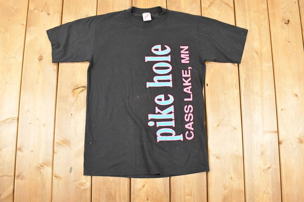 Vintage 1990s Pink Hole Cass Lake Souvenir Travel T-Shirt Women's M