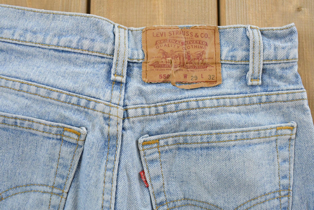 Vintage 1990s Levi's 550 Relaxed Tapered Denim Jeans Women's 28 x 31 / 90s Levi's / Distressed Sun Faded Jeans / Streetwear / Made in USA