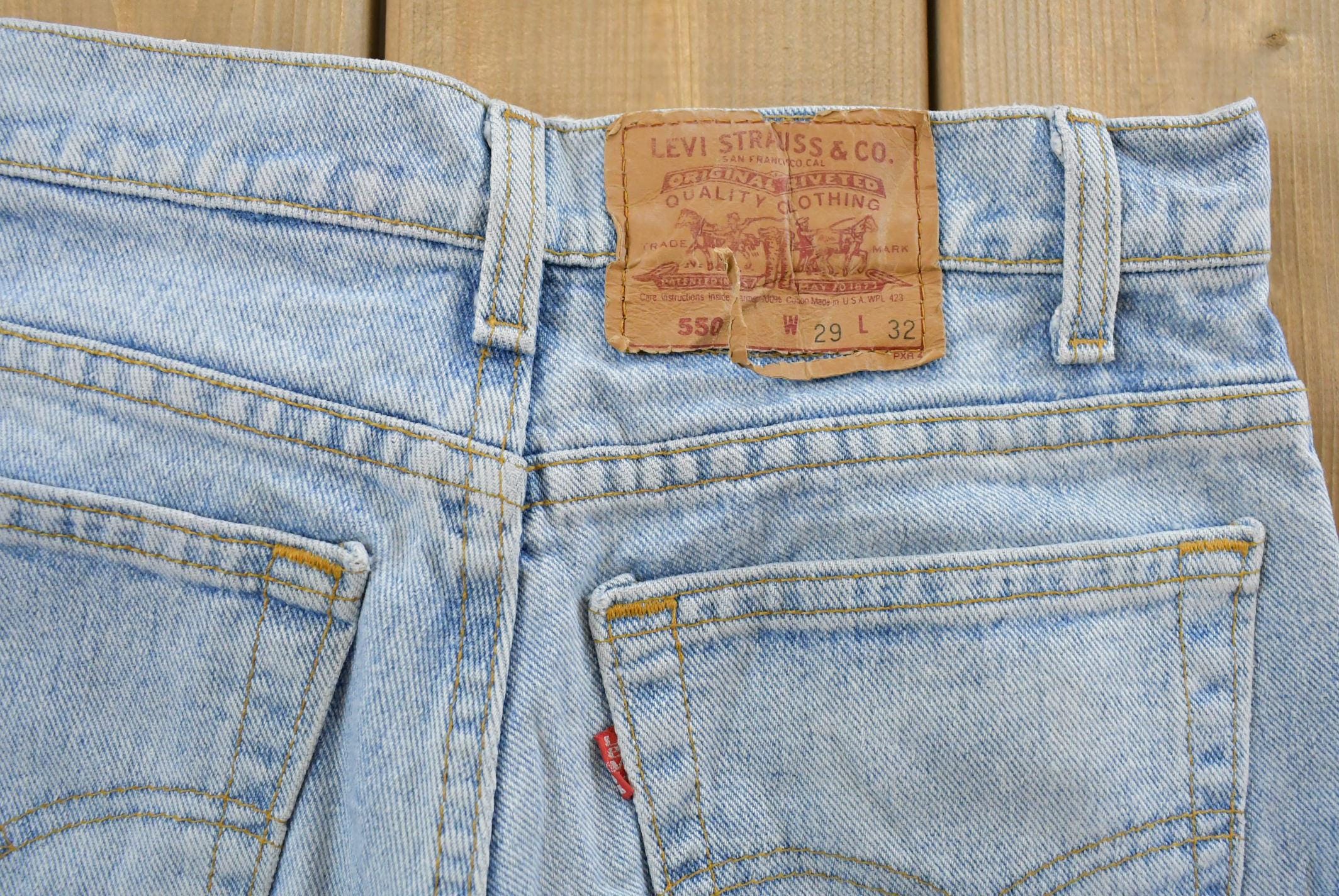 Vintage 1990s Levi's 550 Relaxed Tapered Denim Jeans Women's 28 x 31 / 90s Levi's / Distressed Sun Faded Jeans / Streetwear / Made in USA