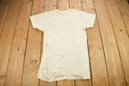 Vintage 1980s Uniroyal Unspeakably Tough Tires Graphic T Shirt