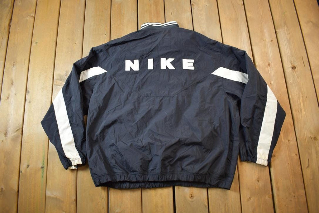 Vintage 1990s Nike Red Tab Back Spellout Windbreaker Jacket - XXL