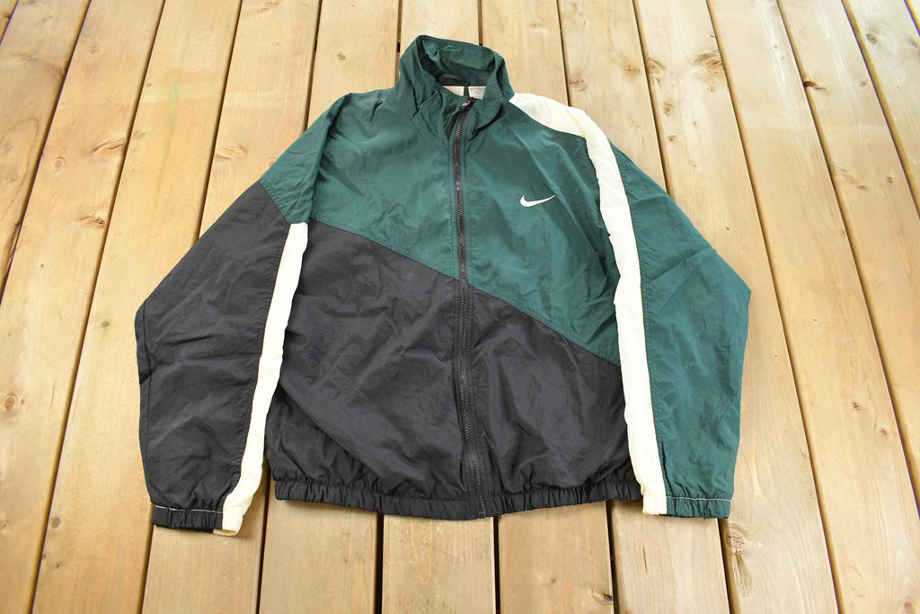 Vintage 1990s Nike Mini Swoosh Windbreaker Jacket Men's Medium