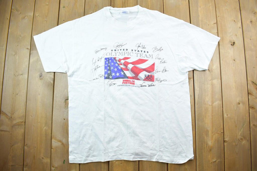 Vintage 1996 United States Olympic Team Wheel Of Fortune Souvenir T-Shirt