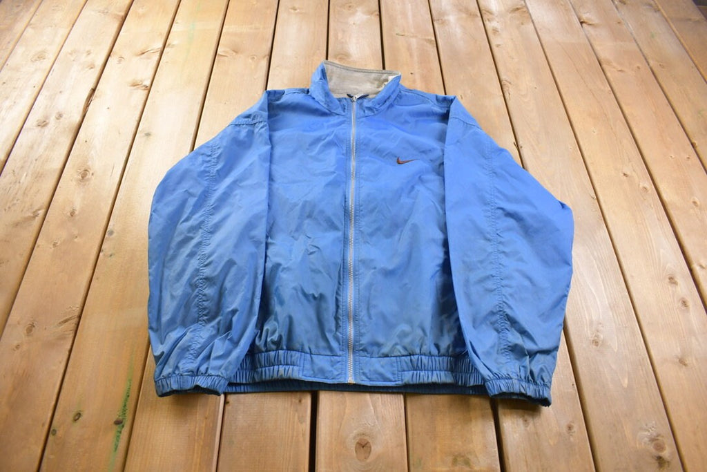 Vintage 1990s Nike Embroidered Mini Swoosh Windbreaker Jacket