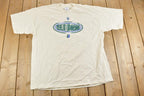 Vintage 1990s Real Men Real God Souvenir T-Shirt