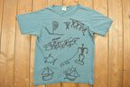 Vintage 1990s Tribal Ocean Themed Graphic T-Shirt  Beach  Retro Style  Made In USA  90s Graphic Tee  Casual Wear  Abstract