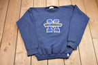 Vintage 1990s Youth St. Mary's Discus Athletics Plaid Embroidered Crewneck Sweatshirt