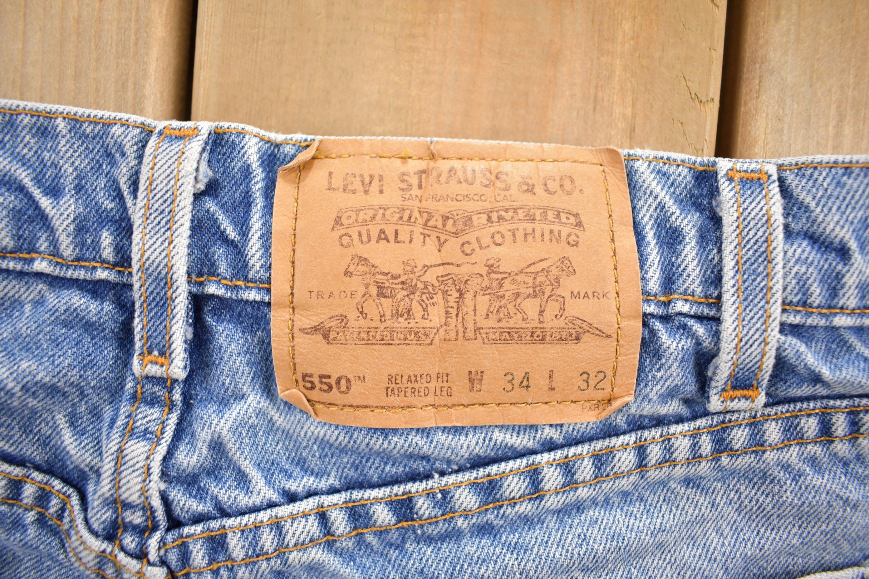 Vintage 1990s Levi's 550 Orange Tab Jeans Size 32 x 30