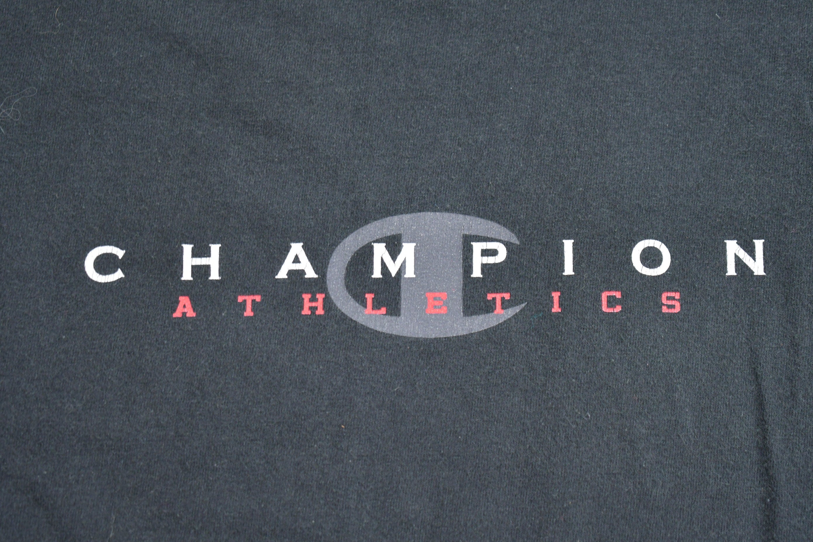Vintage 1990s Champion Athletics Graphic T Shirt
