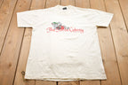 Vintage 1990s Screen Stars Best The Swiss Colony Graphic T-Shirt