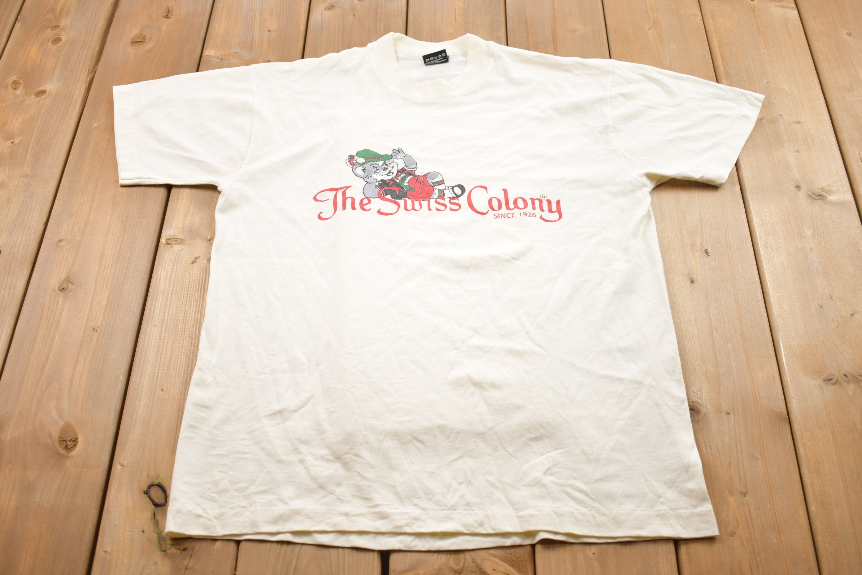 Vintage 1990s Screen Stars Best The Swiss Colony Graphic T-Shirt