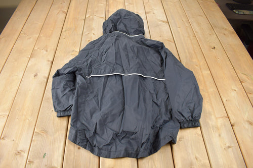 Vintage 1990s Black Nike Mini Swoosh Women's Windbreaker Jacket Size M