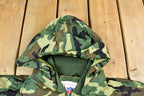 Vintage 1990s Camo Raiders NFL Football Hooded Puffer Jacket