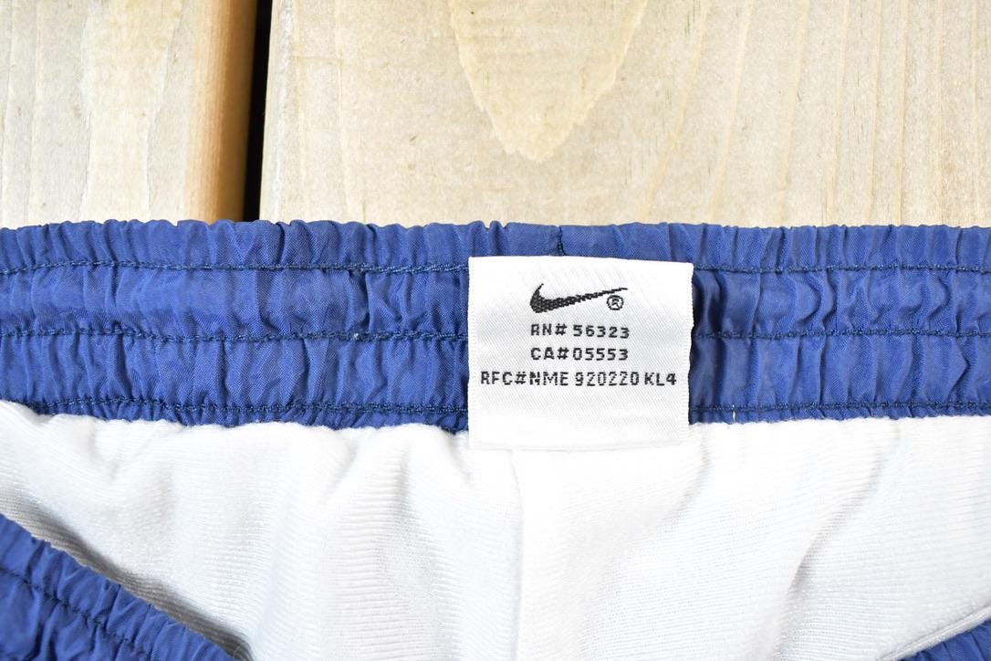 Vintage 1990s Nike Quarter Tearaway Mini Swoosh Splash Athletic Pants Size XL
