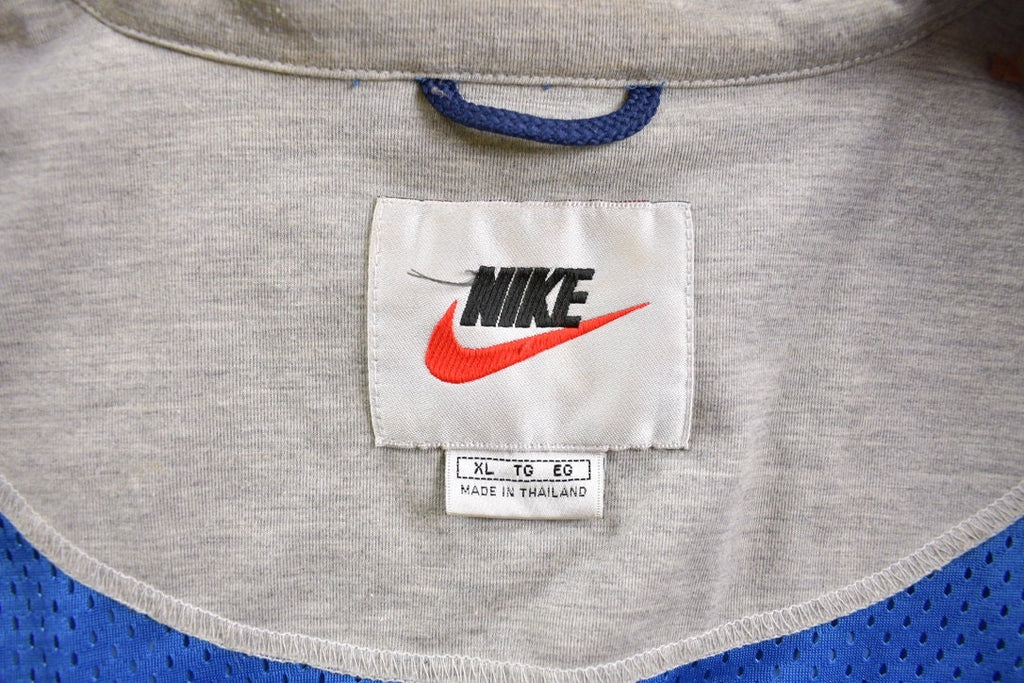 Vintage 1990s Nike Embroidered Mini Swoosh Windbreaker Jacket