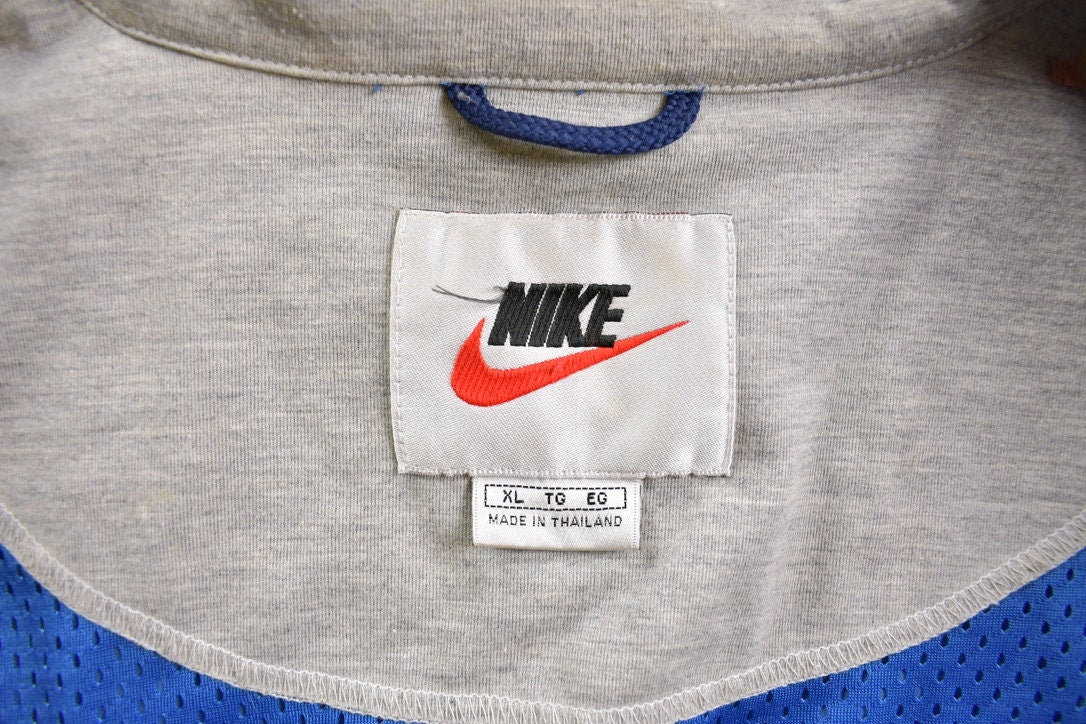 Vintage 1990s Nike Embroidered Mini Swoosh Windbreaker Jacket