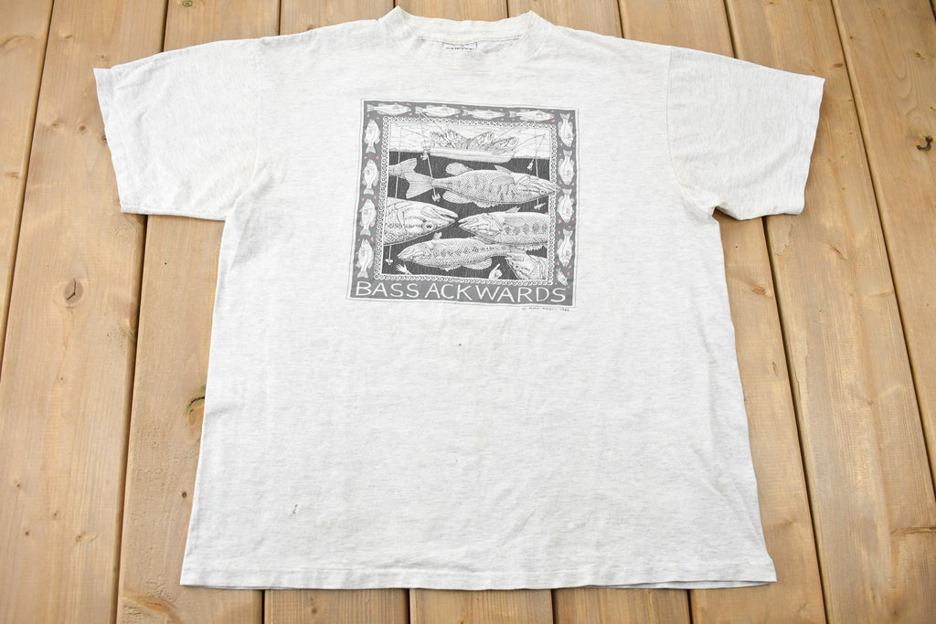 Vintage 1988 Bass Ackwards Fish Ray Troll Graphic T-Shirt