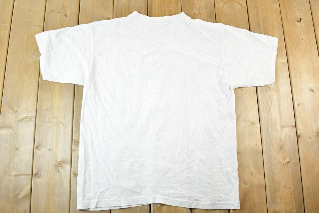 Vintage 1990s Fossil USA Worldwide Souvenir T-Shirt Mens L