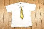 Vintage 1990's Happy Face Tie Souvenir Travel T-Shirt Mens M