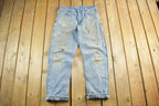 Vintage 2000s Carhartt Distressed Flannel Lined Denim Work Jeans Men's 34 x 33