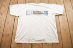 Vintage 1990s Compuware E-Commerce Graphic T-Shirt