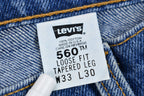 Vintage 1990s Levi's 560 Medium Wash Loose Fit Tapered Leg Mom Jeans