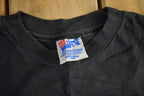 Vintage 1990s Brieland Graphics Glow In The Dark Eyes T-Shirt Men's Large