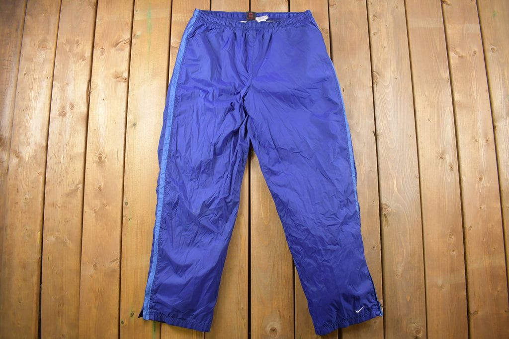 Vintage 1990s Blue Nike Mini Swoosh Track Pants Size L