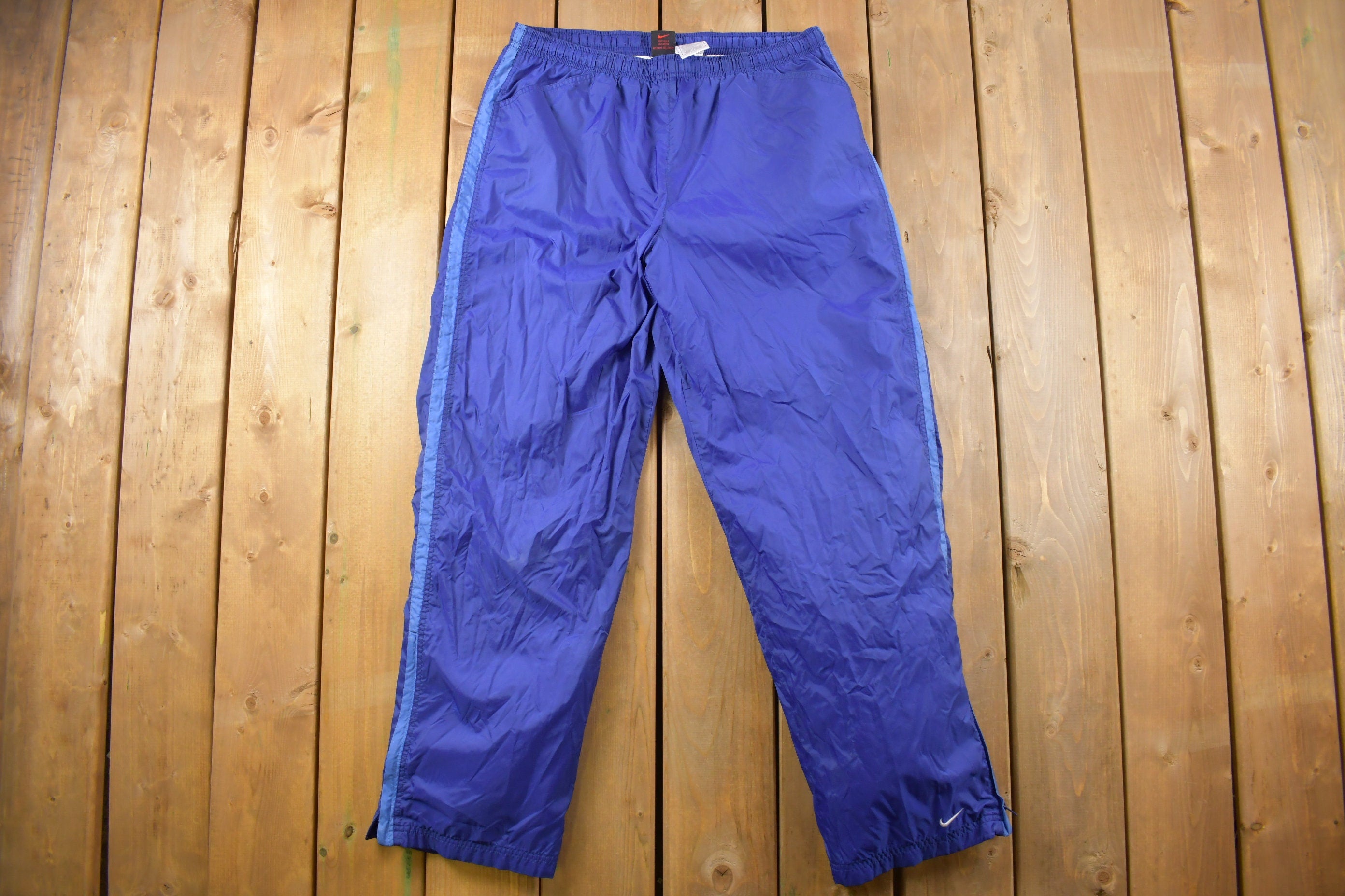 Vintage 1990s Blue Nike Mini Swoosh Track Pants Size L