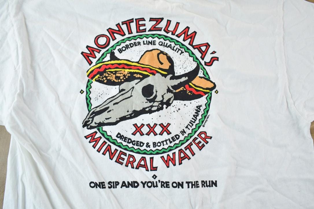 Vintage 1980s Crazy Shirts Montezumas Mineral Water Souvenir Single Stitch Graphic Print T-Shirt