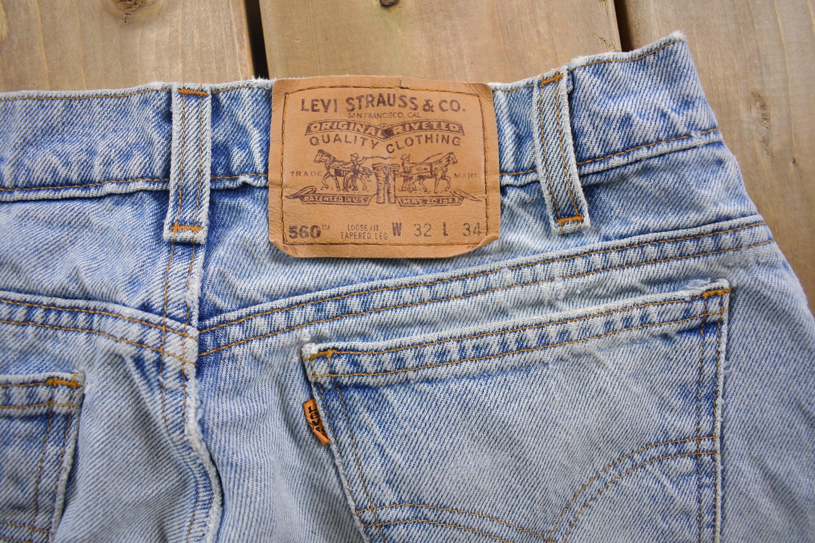 Vintage 1990s Levi's 560 Orange Tab Denim Jeans Size 28 x 32