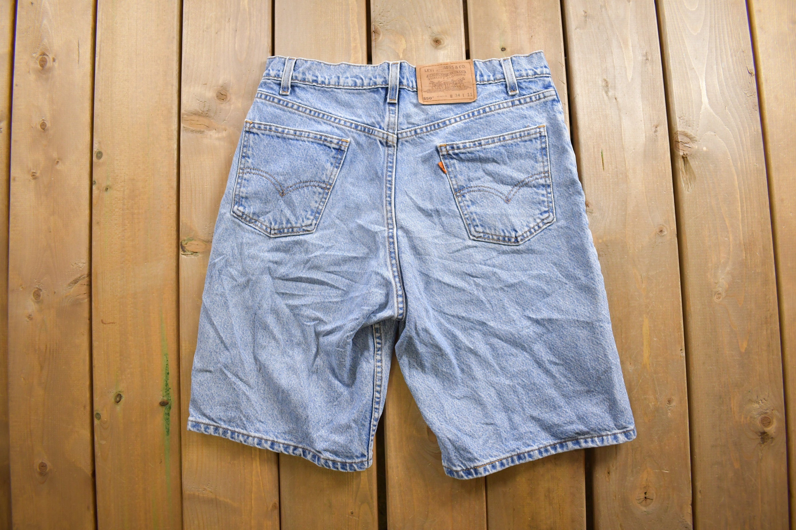 Vintage 1990s Levi's 550 Orange Tab Denim Shorts Size 31 x 6.5