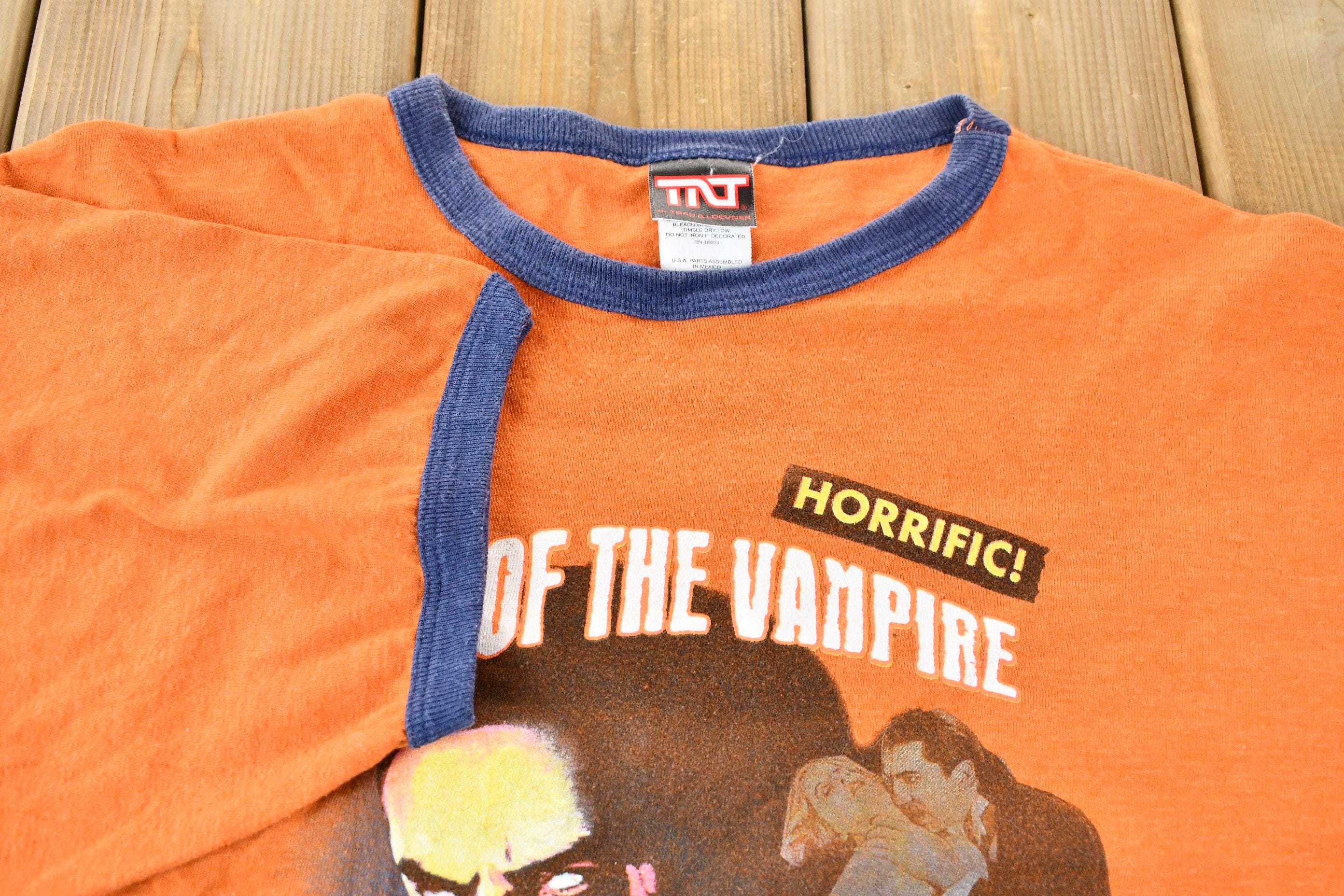 Vintage 2005 Dracula Night of the Vampire Orange and Blue Ringer Graphic T-Shirt